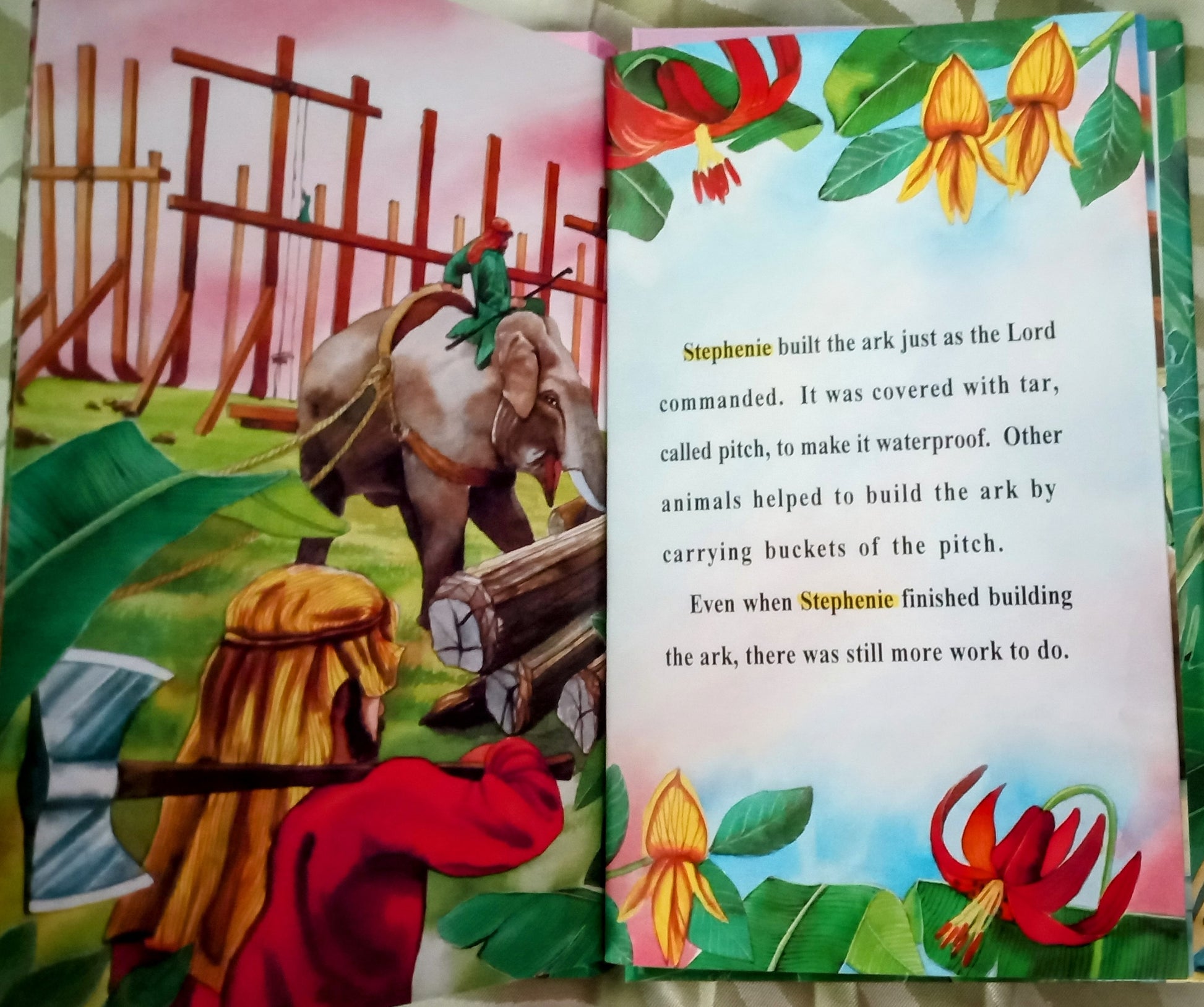 Open personalized book with illustrations and personalized text about building an ark, featuring a character and animals.