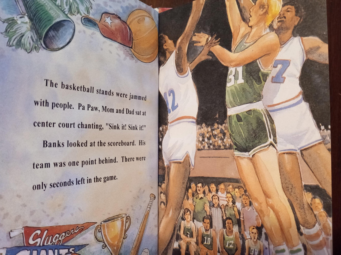 Basketball-themed personalized children's book page with illustration of players and personalized text